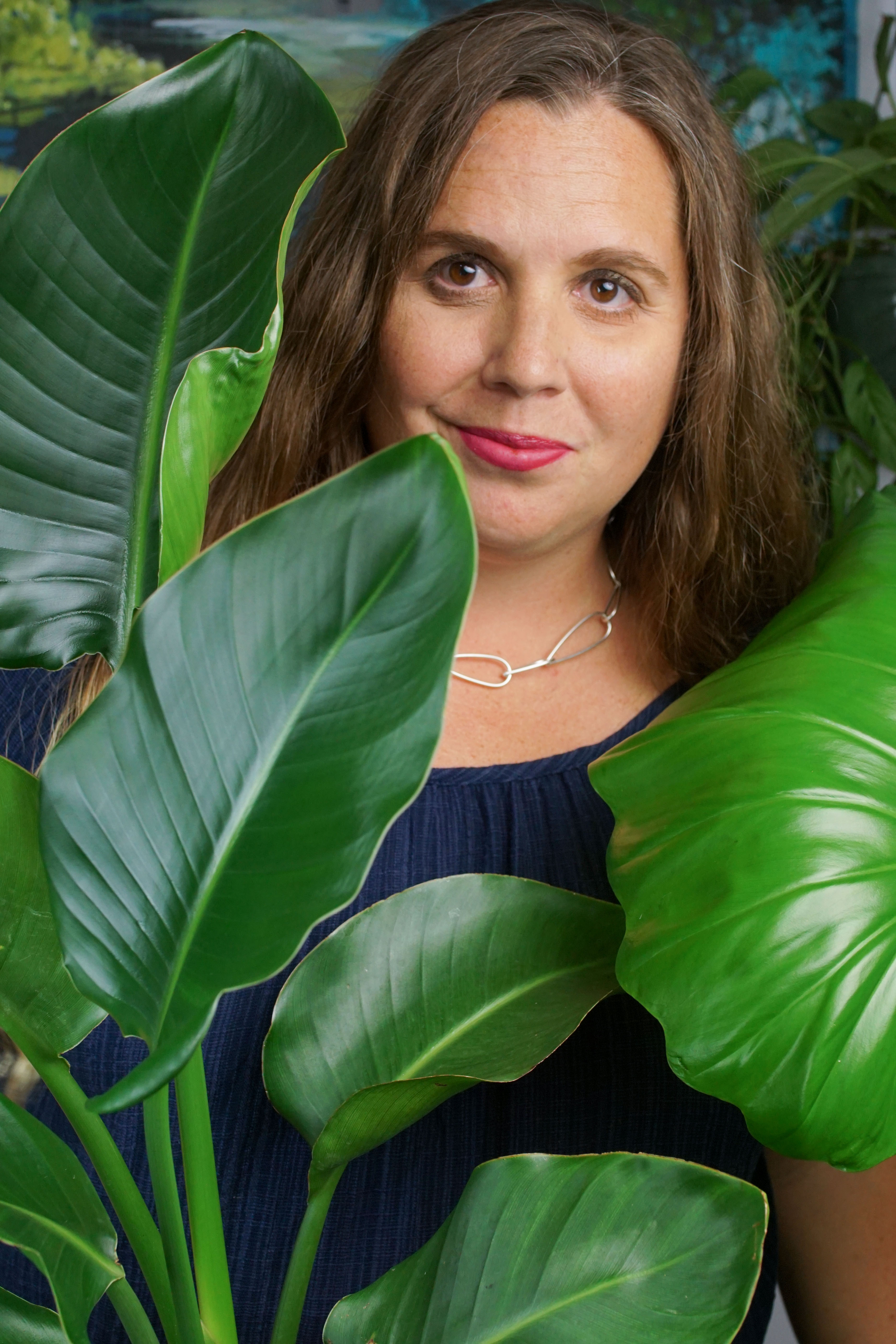 tropical resort jungle vibes: self portrait with plants and chunky silver chain necklace