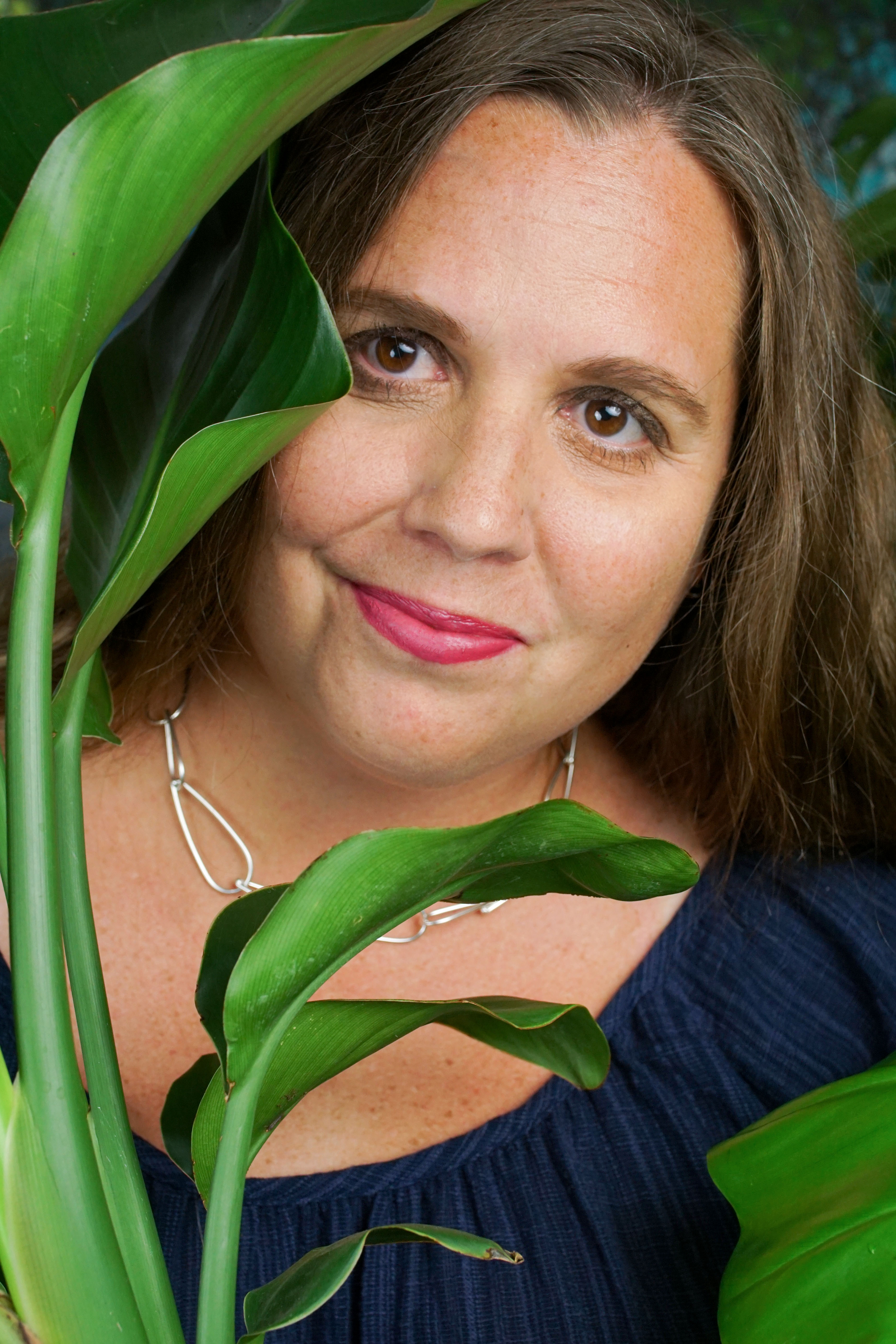 tropical resort jungle vibes: self portrait with plants and chunky silver chain necklace