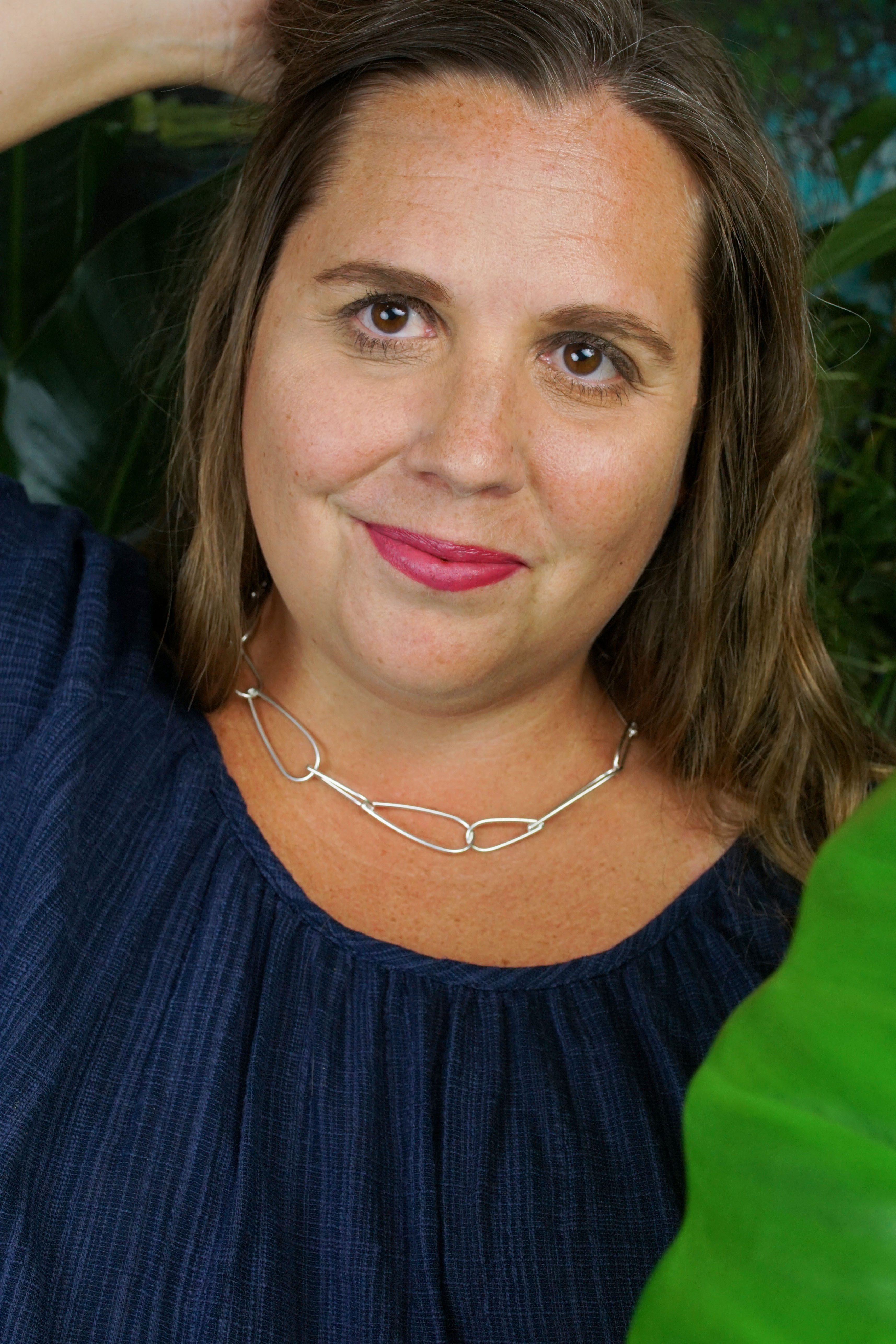 tropical resort jungle vibes: self portrait with plants and chunky silver chain necklace