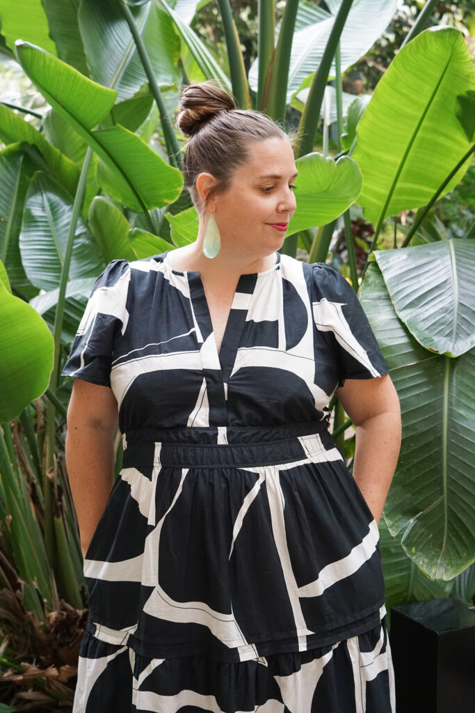 black and white dress and statement earrings in botanical garden