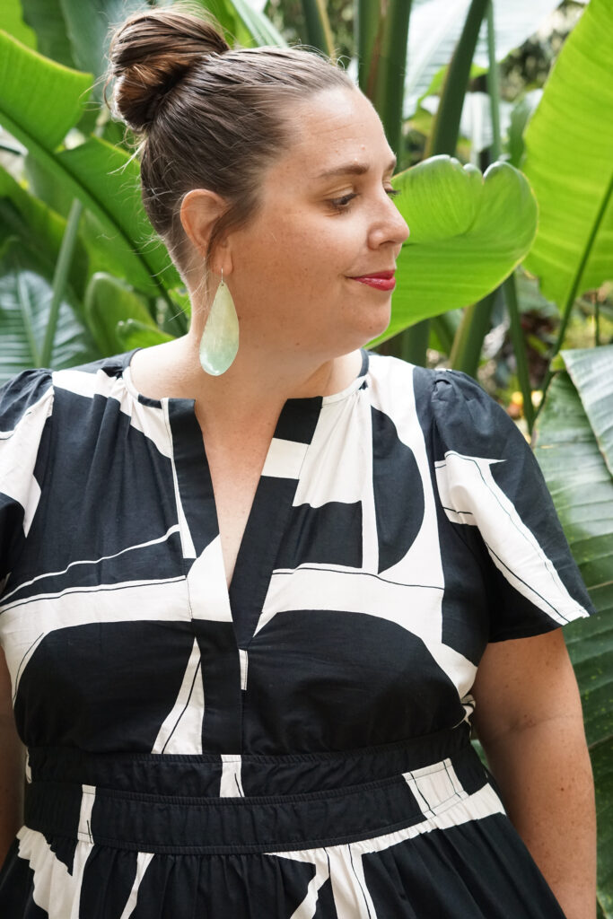 black and white dress and statement earrings in botanical garden