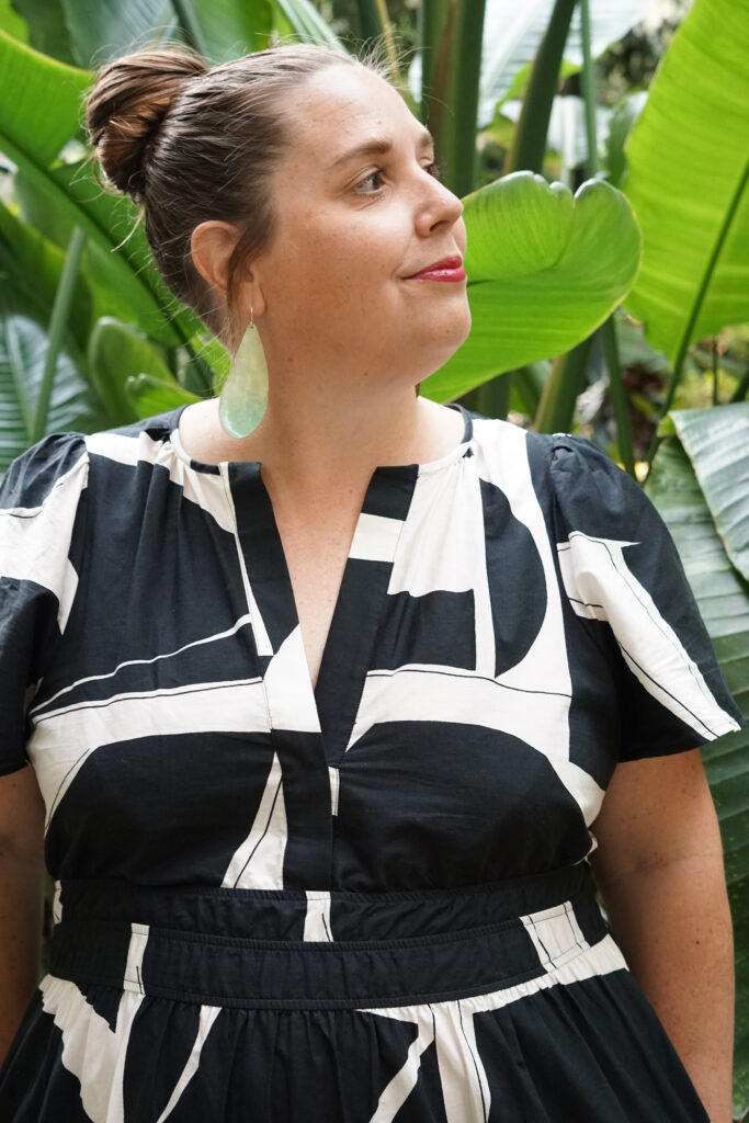 black and white dress and statement earrings in botanical garden