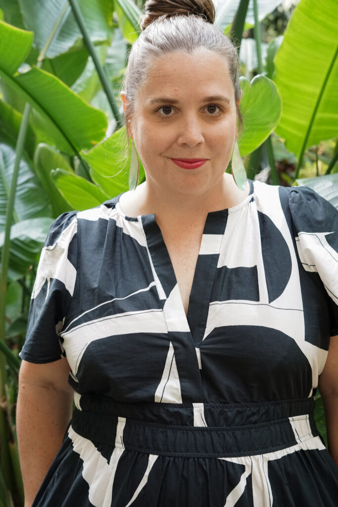 black and white dress and statement earrings in botanical garden