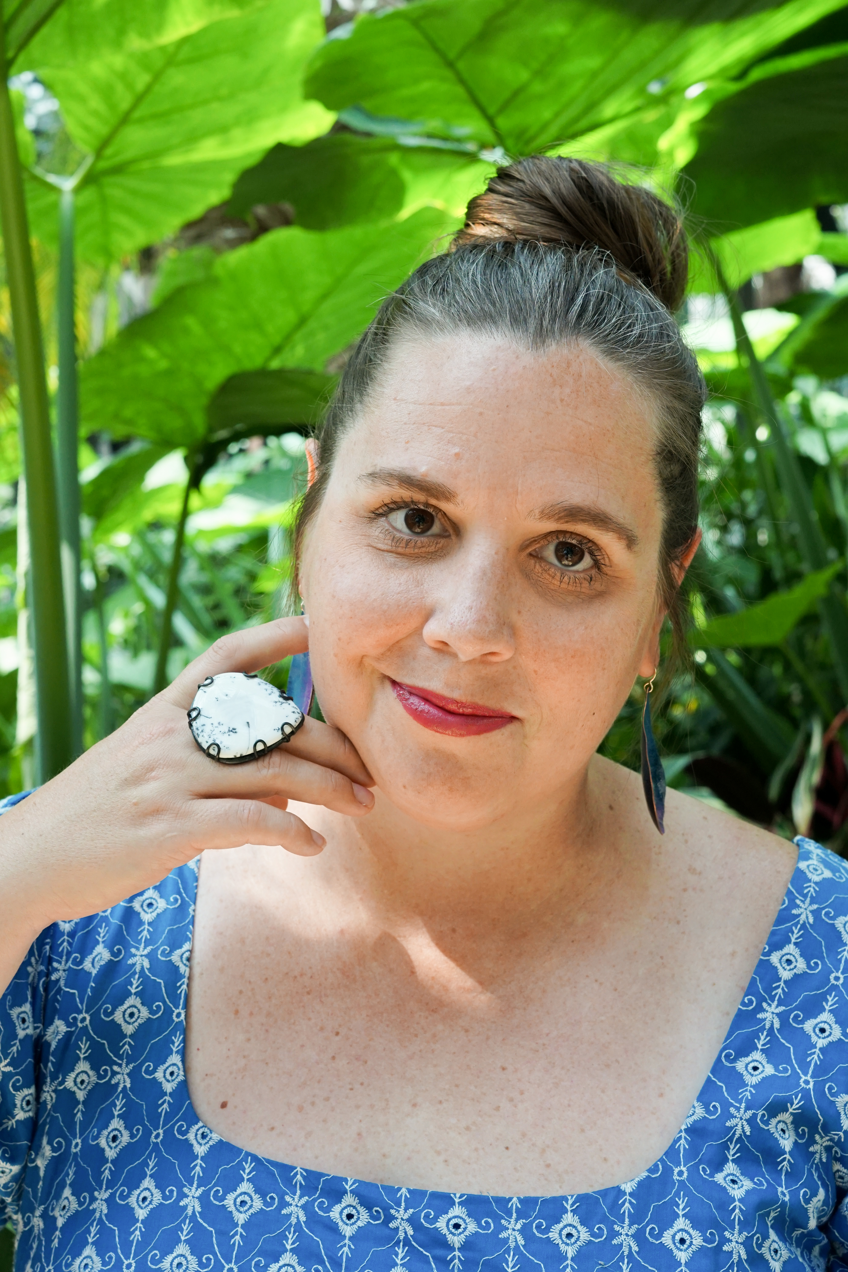 botanical garden portrait with statement ring and earrings