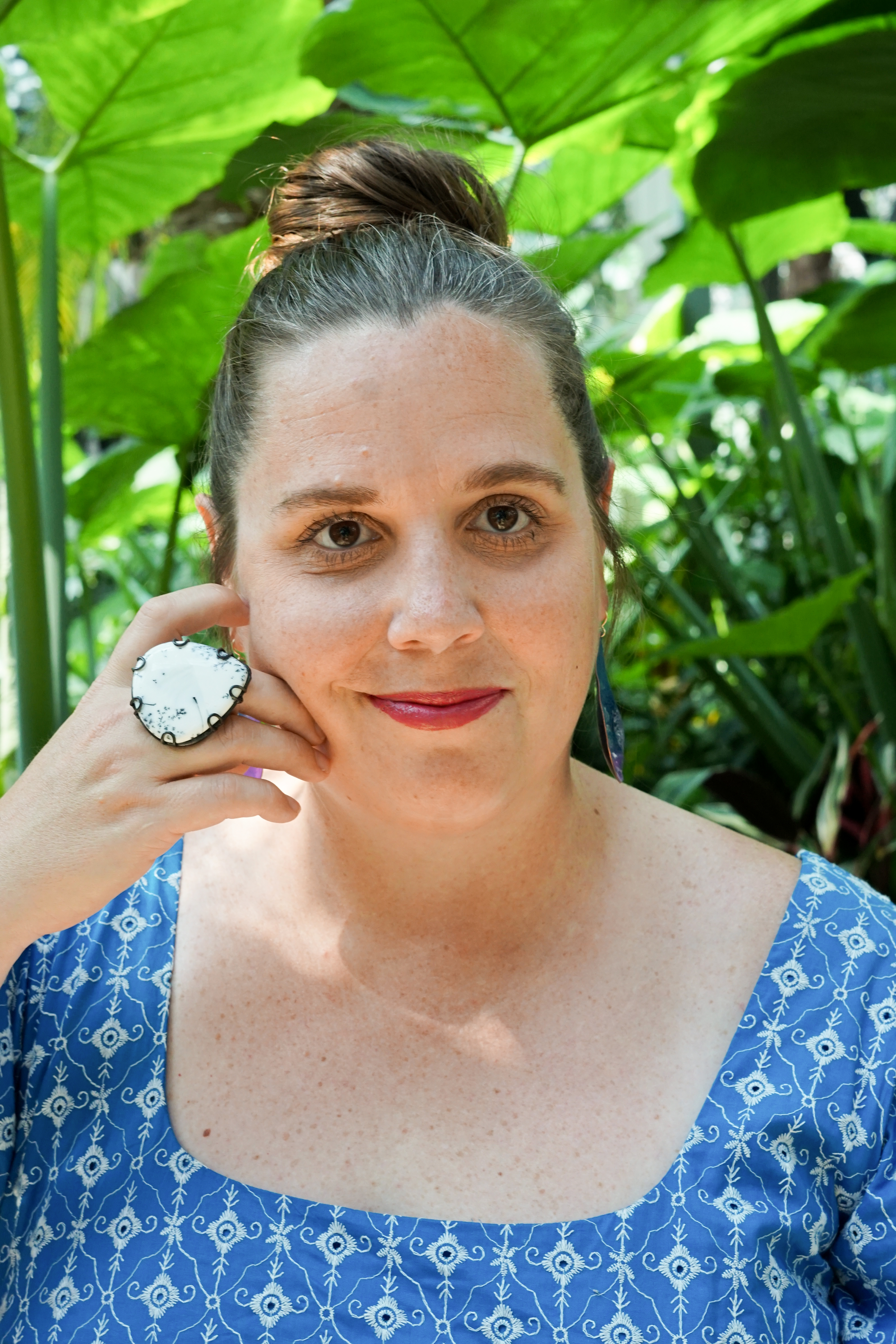 botanical garden portrait with statement ring and earrings