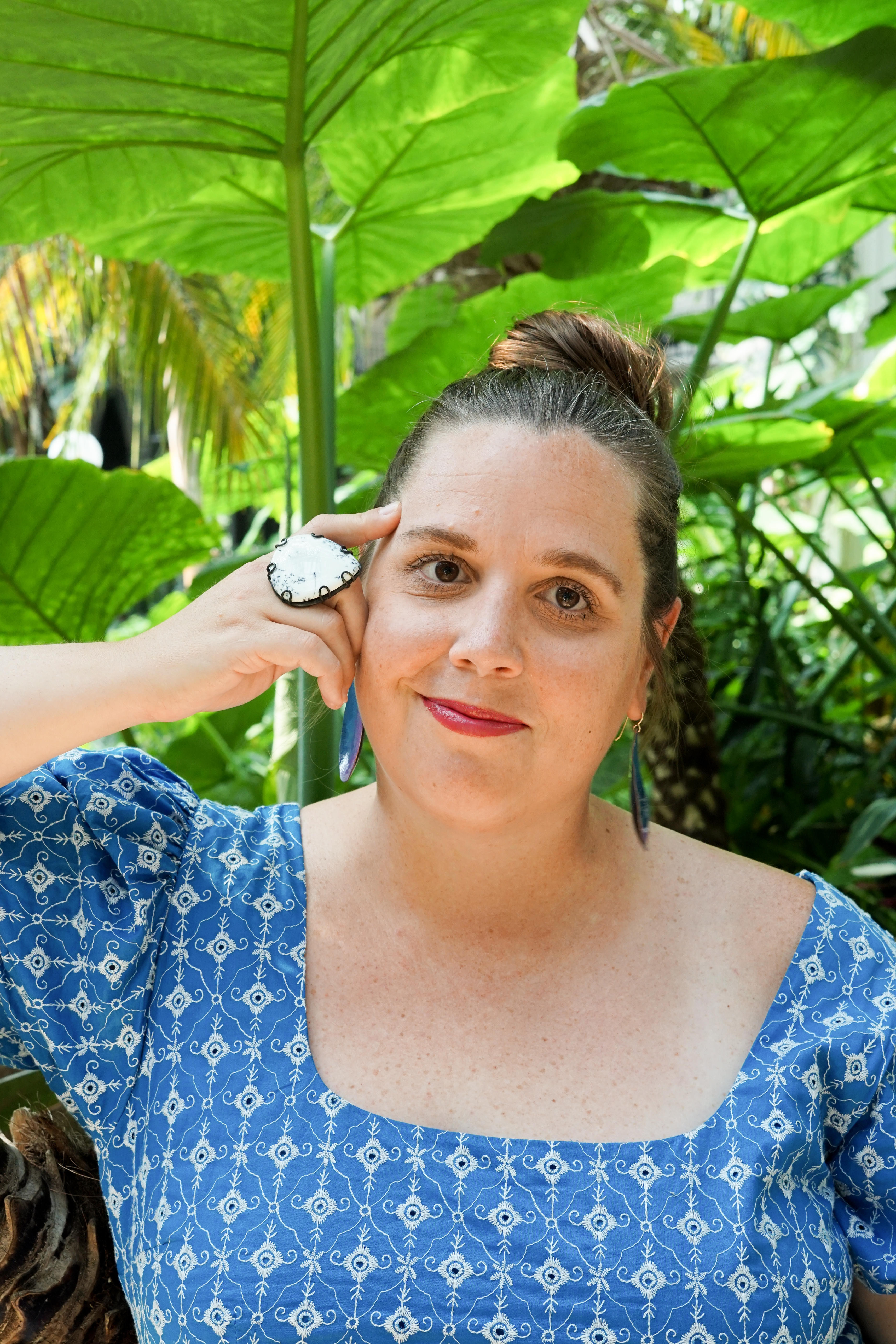 botanical garden portrait with statement ring and earrings