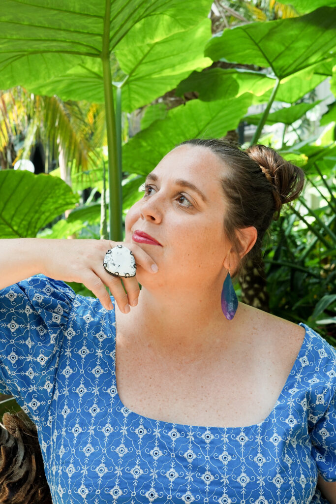 botanical garden portrait with statement ring and earrings