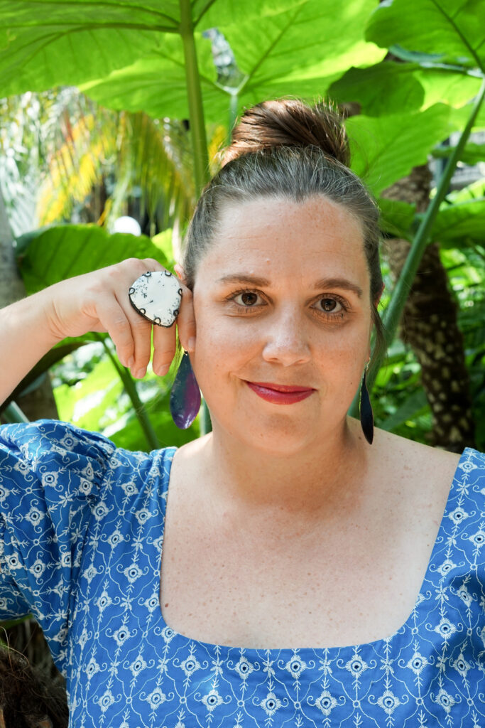 botanical garden portrait with statement ring and earrings