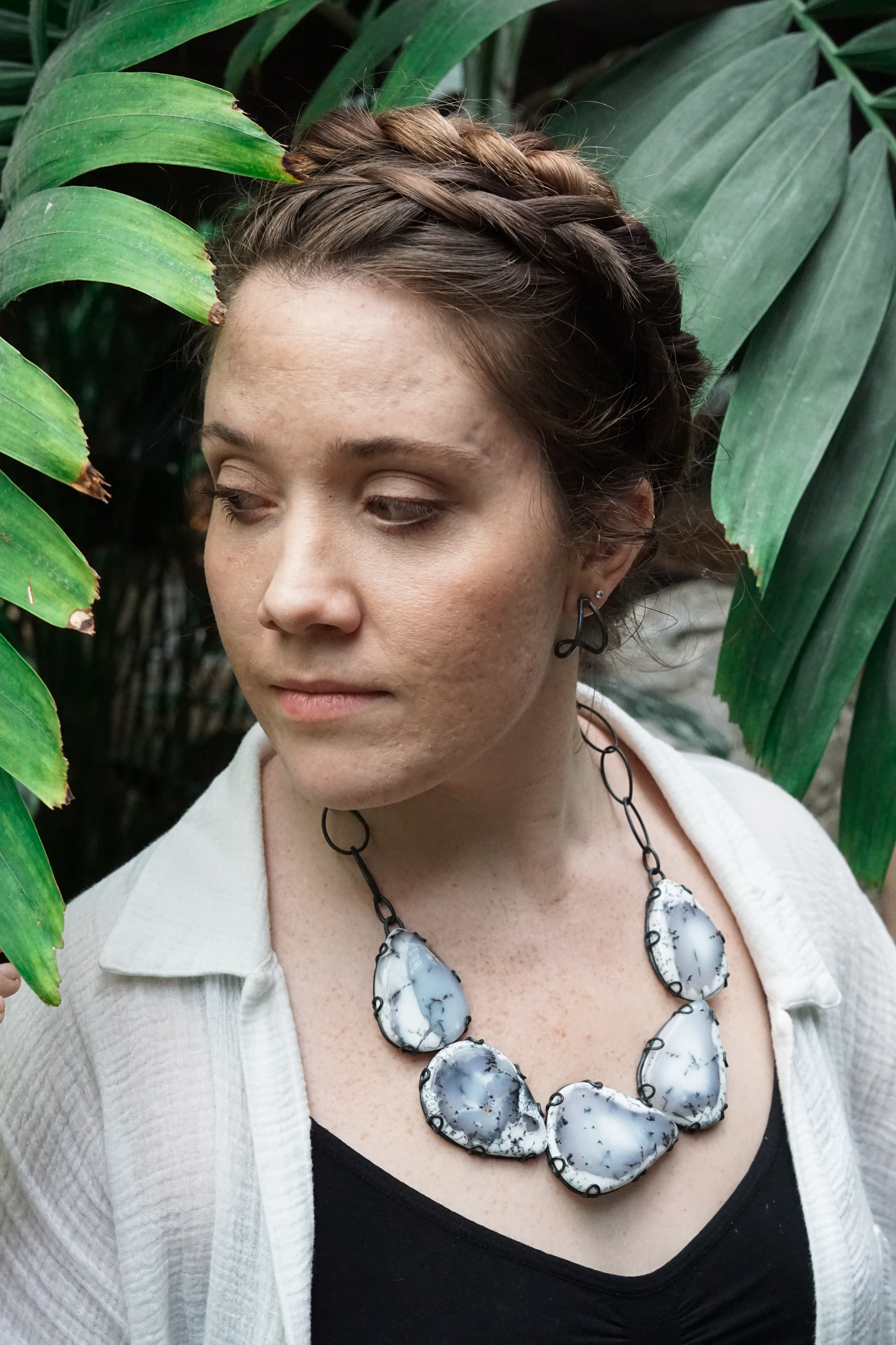 woman in garden wearing statement necklace