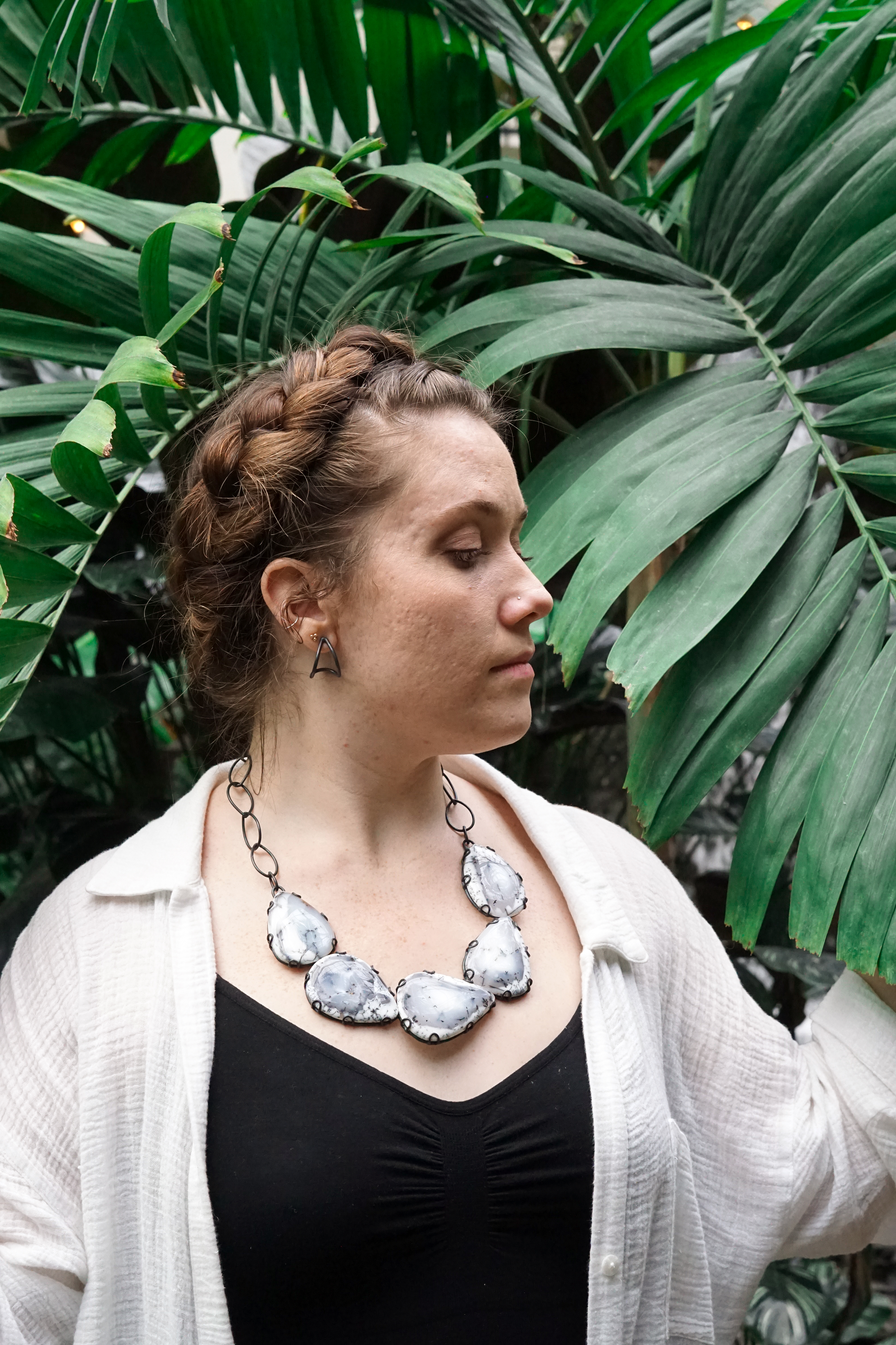 woman in garden with statement necklace